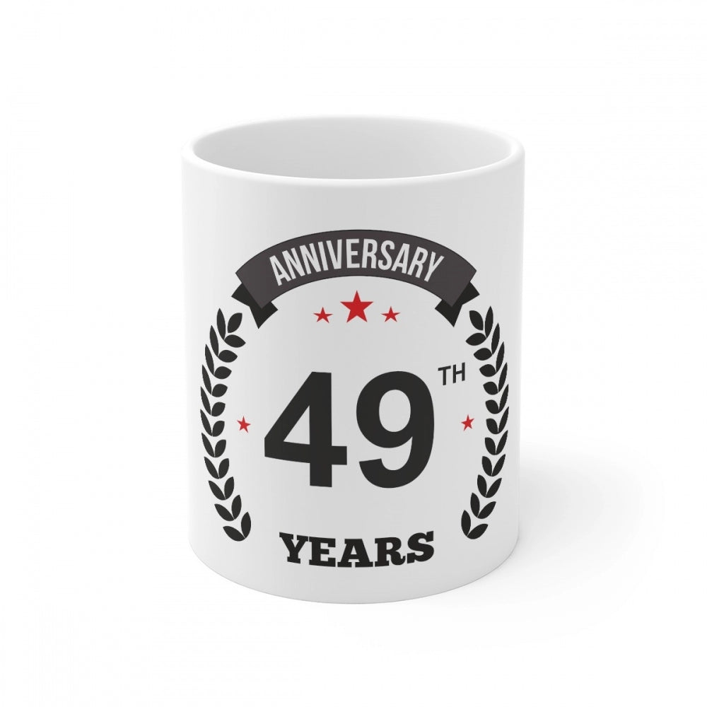 White ceramic coffee mug with printed anniversary message and number
