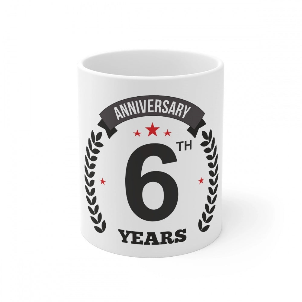 White ceramic coffee mug with a printed anniversary message and the number '6', inscribed in white text