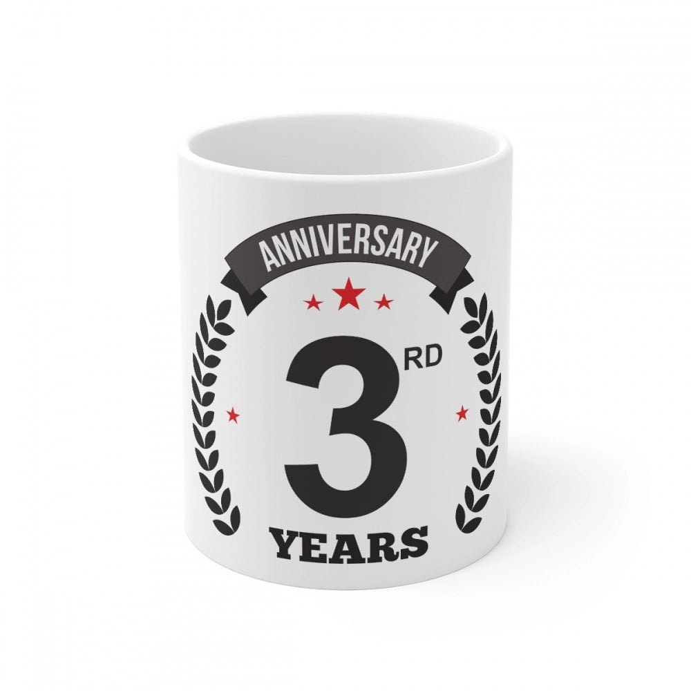 Ceramic coffee mug with white print reading 'Anniversary', and the number '3' in bold. The mug is colored white and has a 330ml capacity