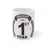 White coffee mug with printed first anniversary message and laurel wreath symbol