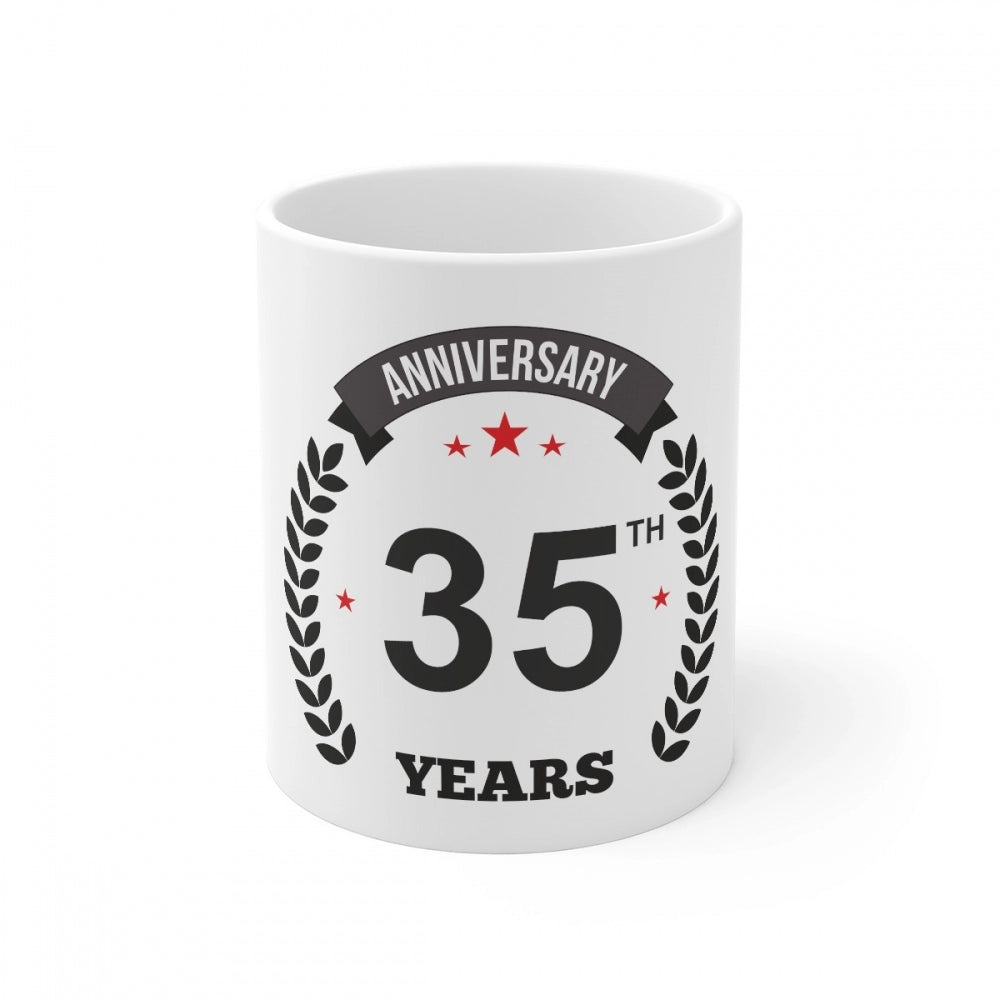 White ceramic coffee mug commemorating 35th anniversary with printed design and "anniversary print", 330ml