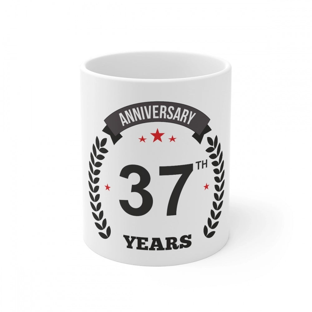 White ceramic coffee mug with anniversary print and laurel design