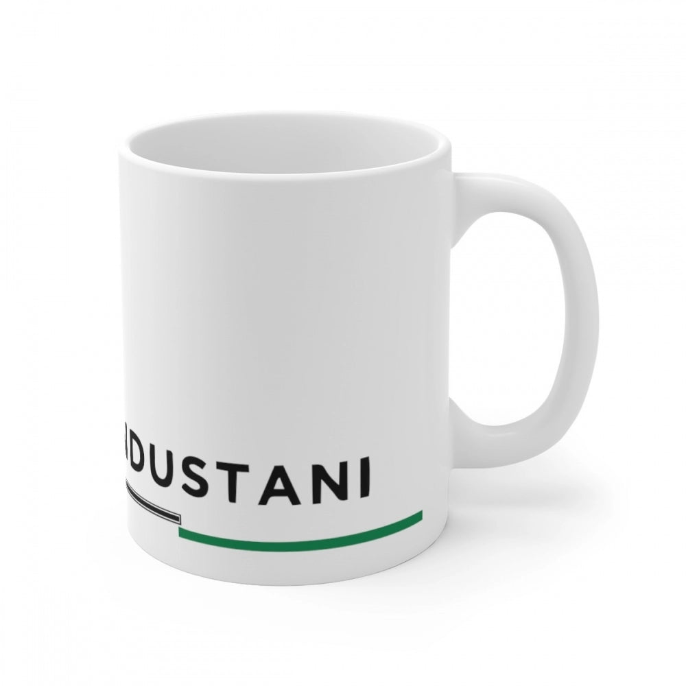 White ceramic coffee mug with blue Hindi print featuring the words 'JUST ANI' and a vertical line