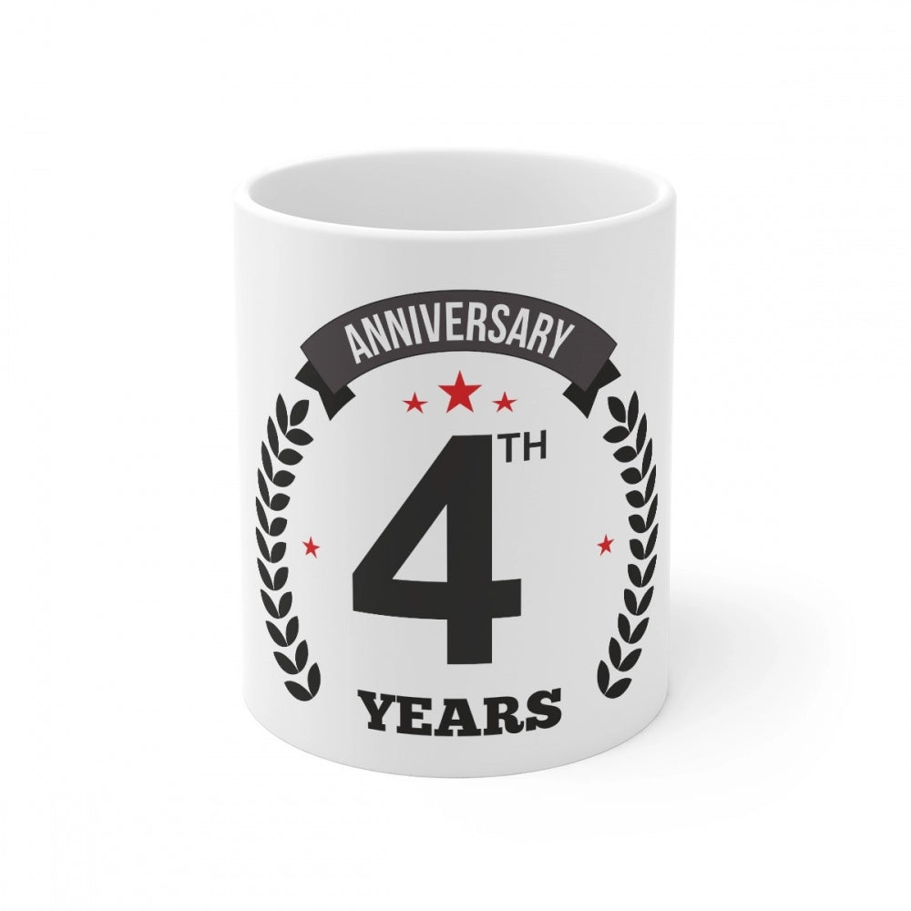 White ceramic mug with black anniversary print, white background