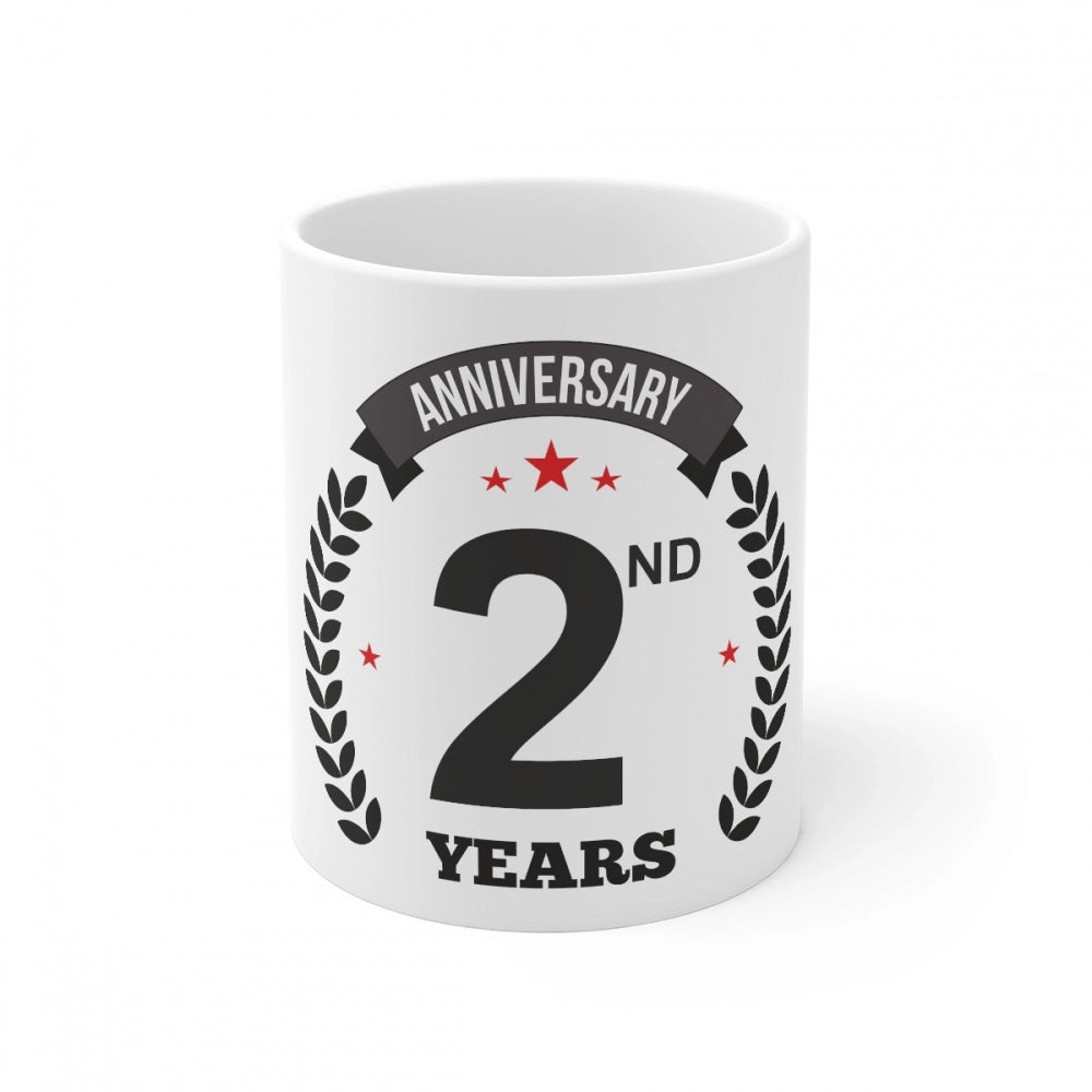 The white coffee mug with a printed anniversary message