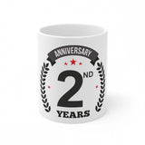 The white coffee mug with a printed anniversary message
