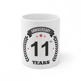 White ceramic coffee mug celebrating 11 years