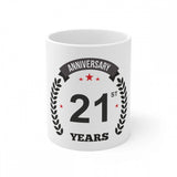 Anniversary ceramic coffee mug with white print and a laurel wreath, "anniversary 21st", reading "Anniversary 21st years