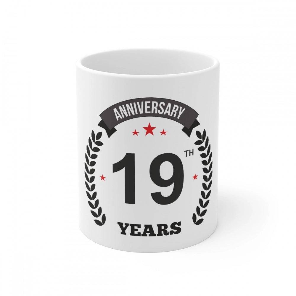 White ceramic mug with anniversary print and laurel wreath