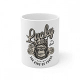 A white ceramic coffee mug with a printed gorilla design and text