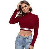 A red crop top with a striped hem and cropped length