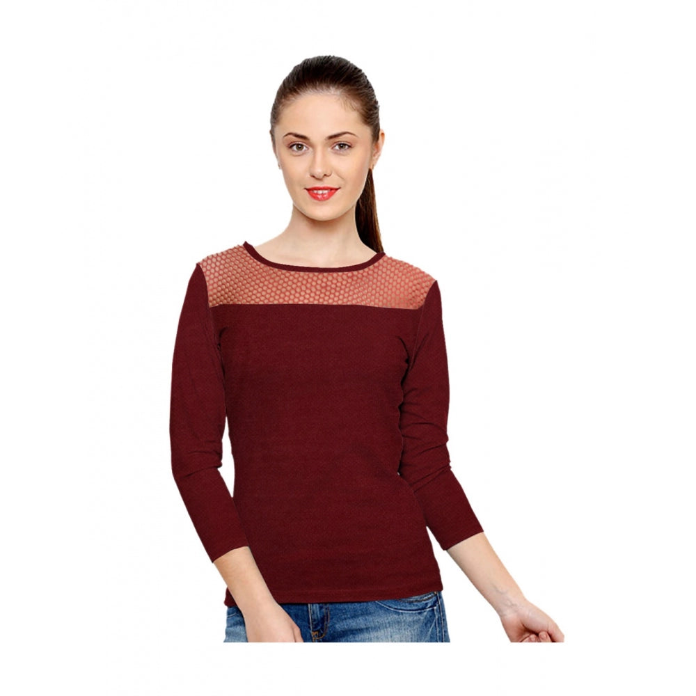 Woman in maroon long-sleeved top with v-neck and round neckline