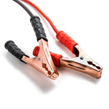 Red copper jumper cables with black grips, heavy-duty booster cables.