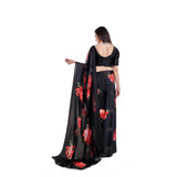 Red satin patta printed saree with unstitched blouse, vibrant Indian women's fashion accessory on display