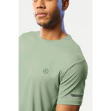 Men's casual pista green polyester half sleeve crew neck t-shirt with regular fit, solid design on mannequin
