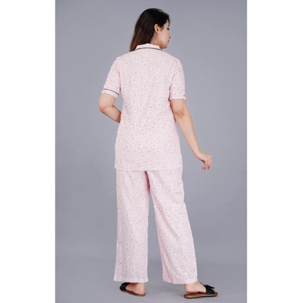 Pink viscose rayon half-sleeve printed shirt with pyjama pant night suit set, notch collar style on a hanger