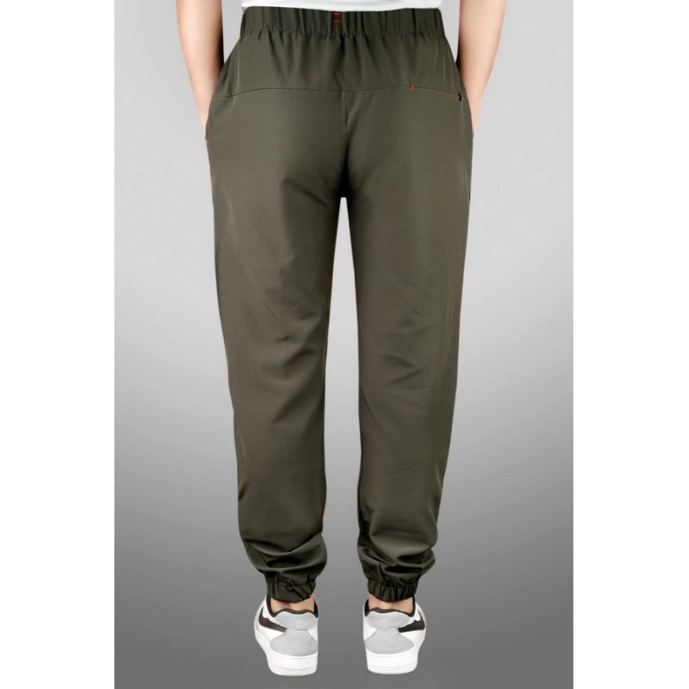 Dark green polyester solid track pants for men on display