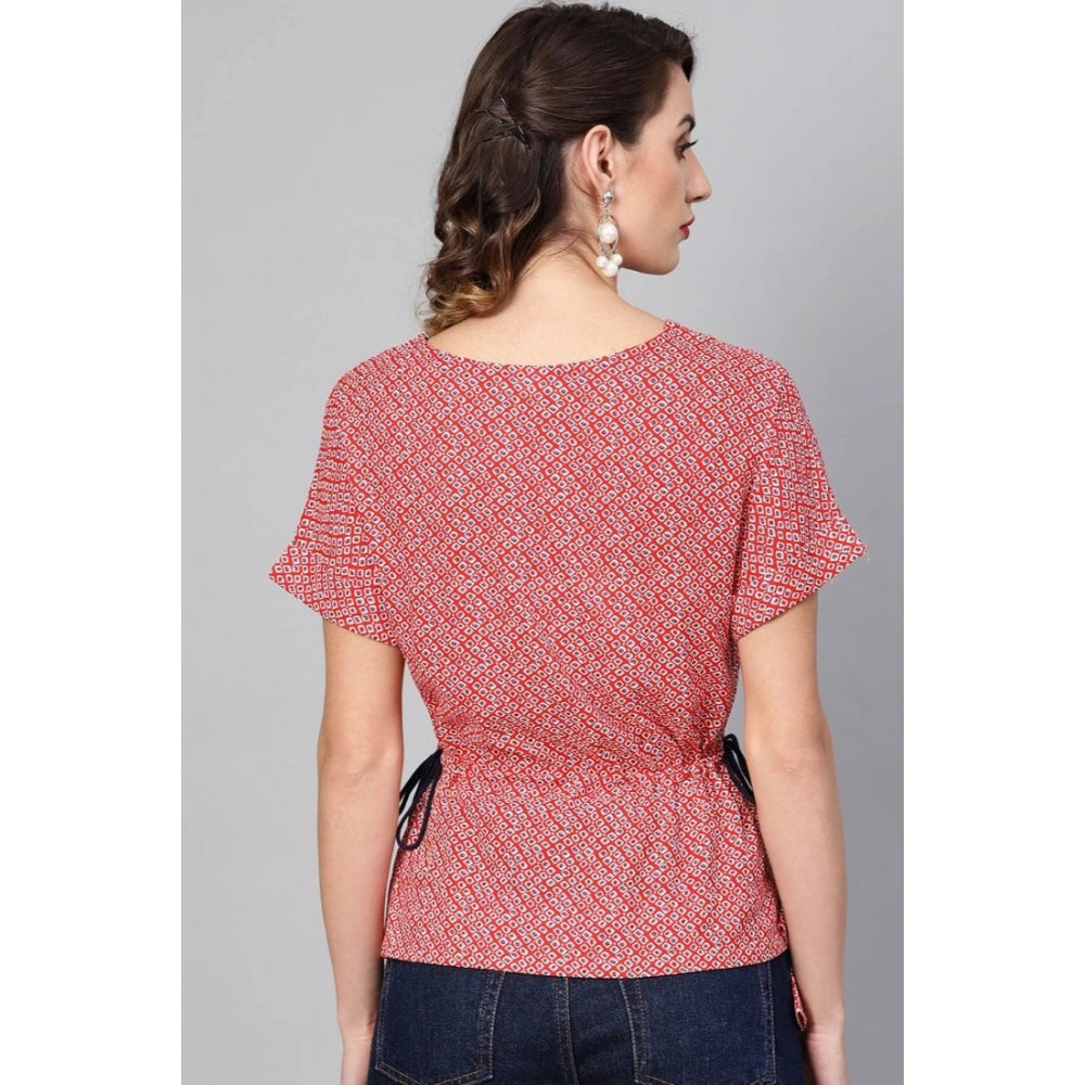 Red geometric rayon women's casual short sleeve top on model