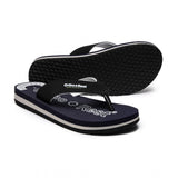 Black rubber slippers with white sole, adjustable Velcro strap