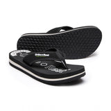 Black rubber doctor slippers with black soles and white trim, featuring a comfortable design for orthopedic support