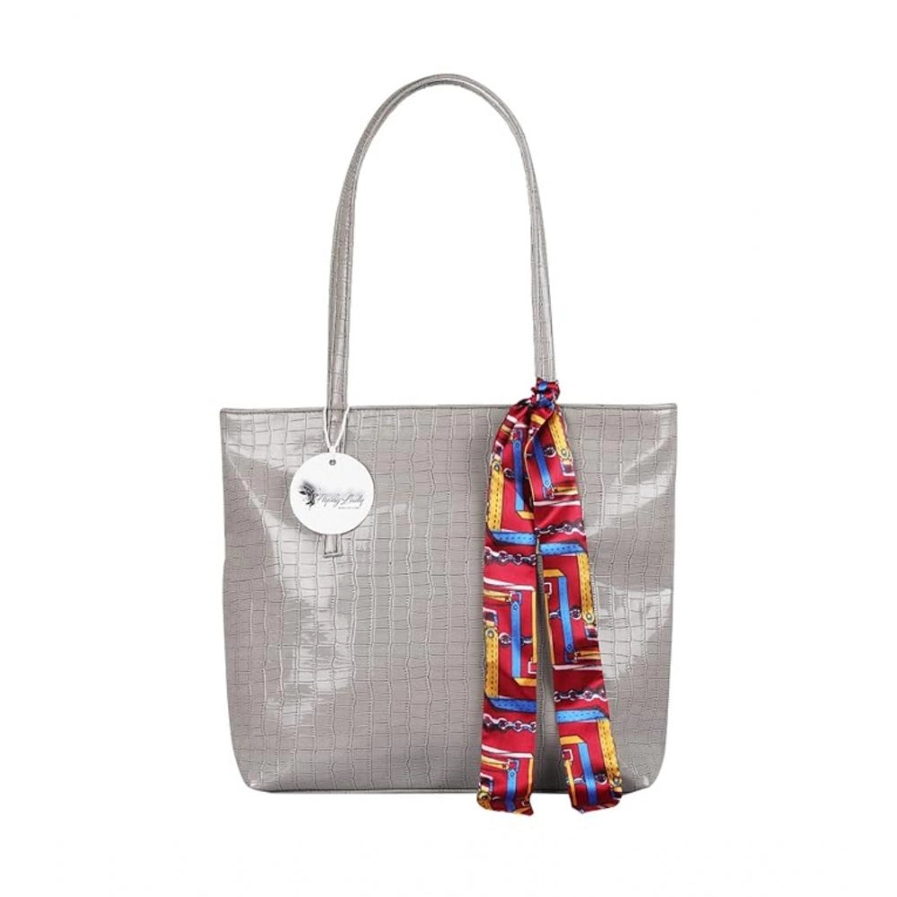 Grey polyurethane textured croc shoulder bag, featuring a long red and blue striped scarf tied in a bow around the handle