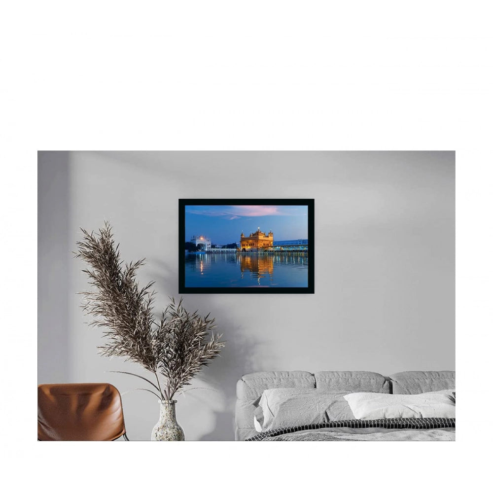 A vibrant wall painting of the Golden Temple, set against a sunset in Amritsar. The frame is multicolored and has a mat board