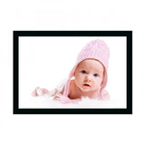 Synthetic photo frame with printed baby portrait in a white frame