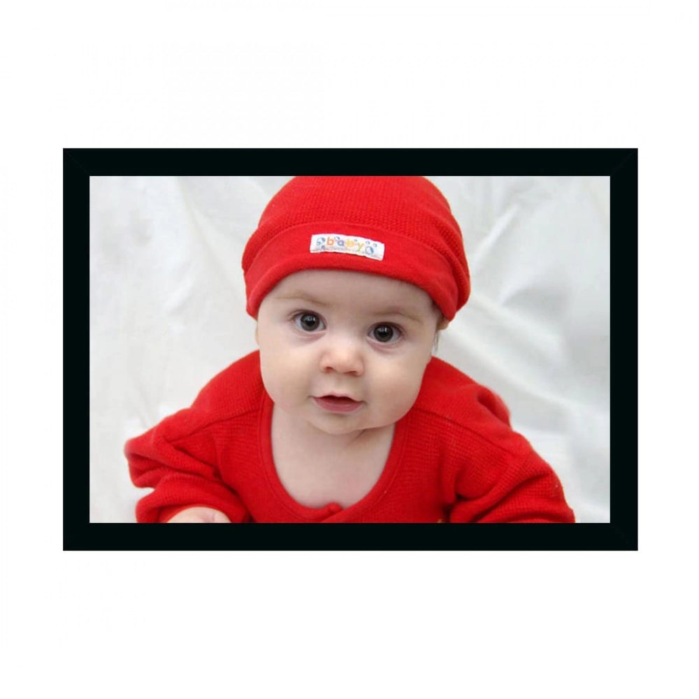 A framed photo of a baby painted in various colors