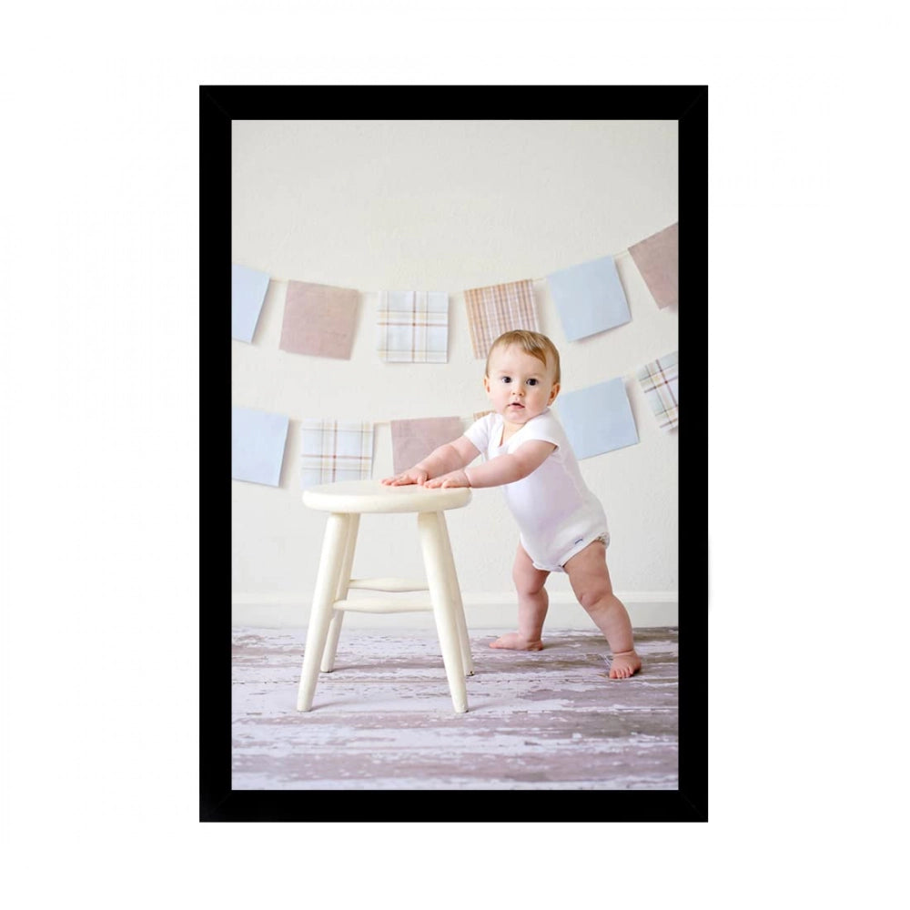 Baby photo painting on table in room