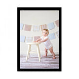 Baby photo painting on table in room