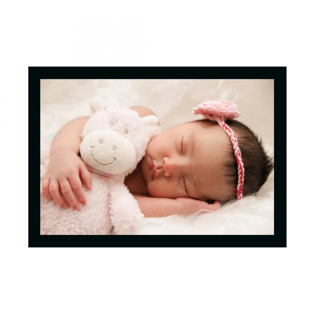 Baby wearing a pink bow, holding a stuffed animal, smiling, lying on a white surface