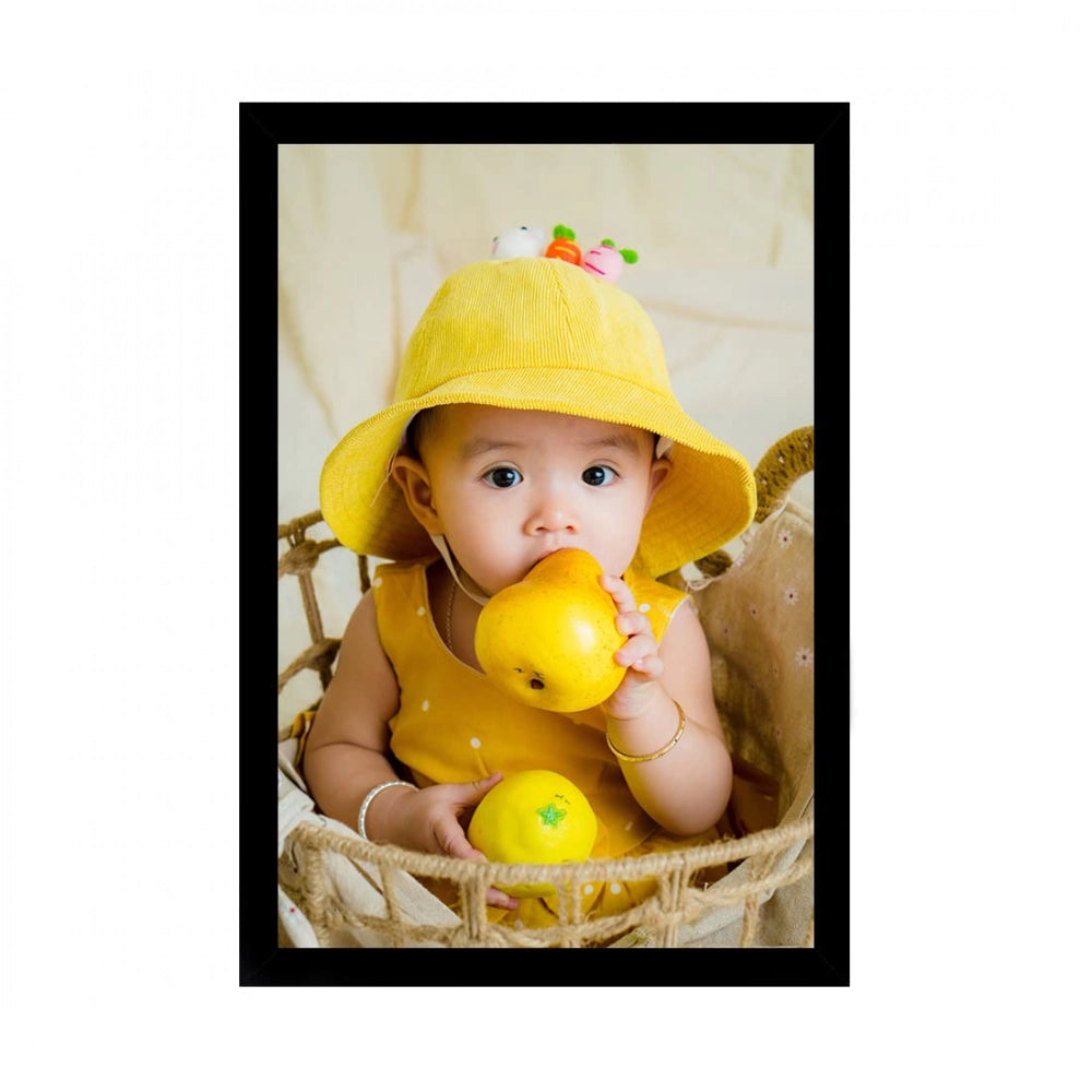 Baby wearing yellow hat, holding fruit in wicker basket