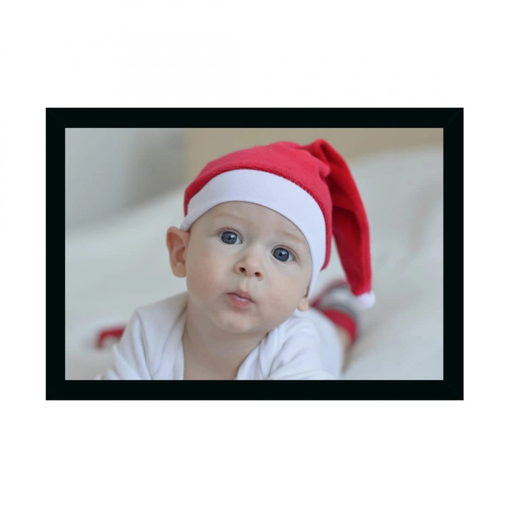 Multicolor painting of a baby wearing a Santa hat, in a photo frame