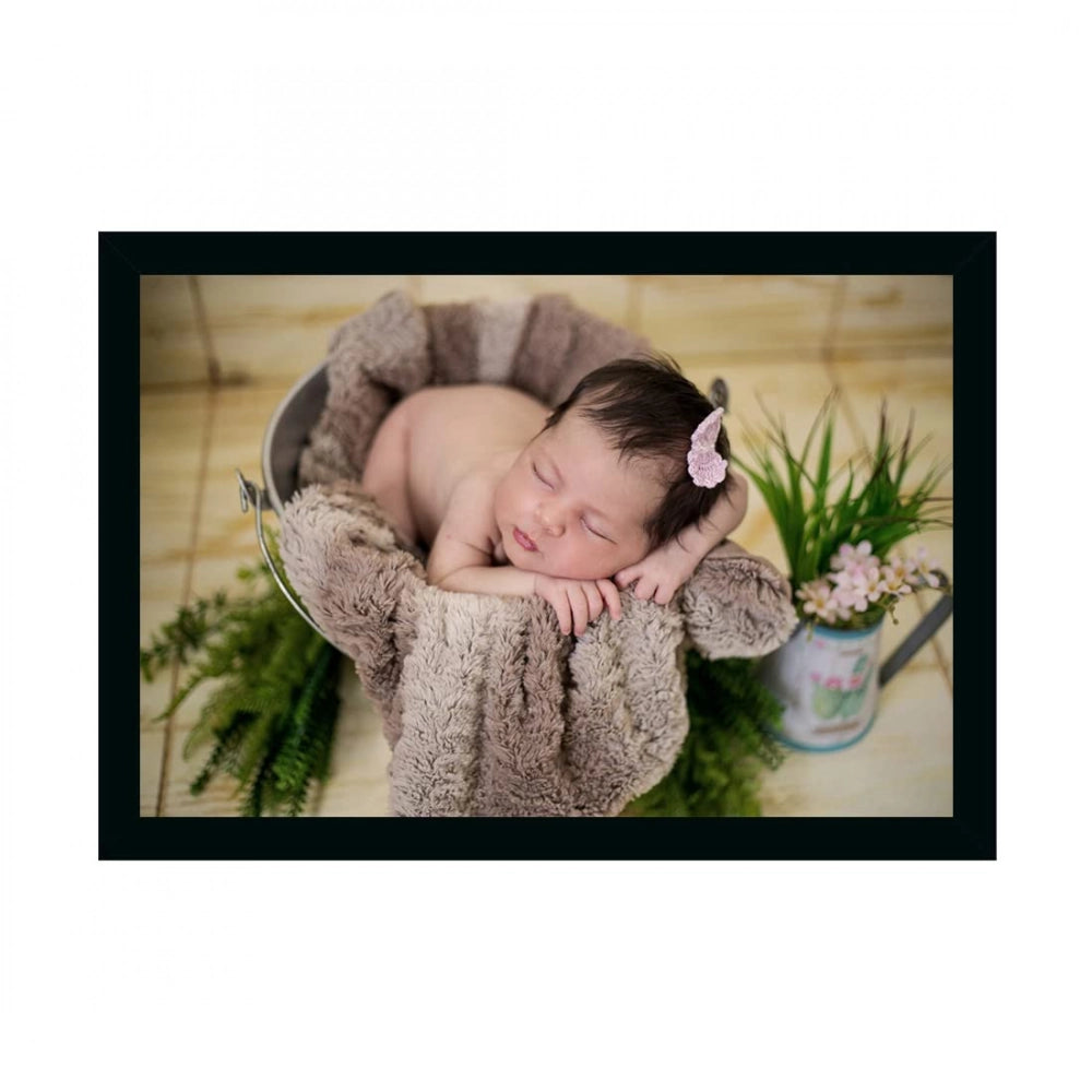 Synthetic photo frame painting of a baby laying in a basket with plants, multicolor