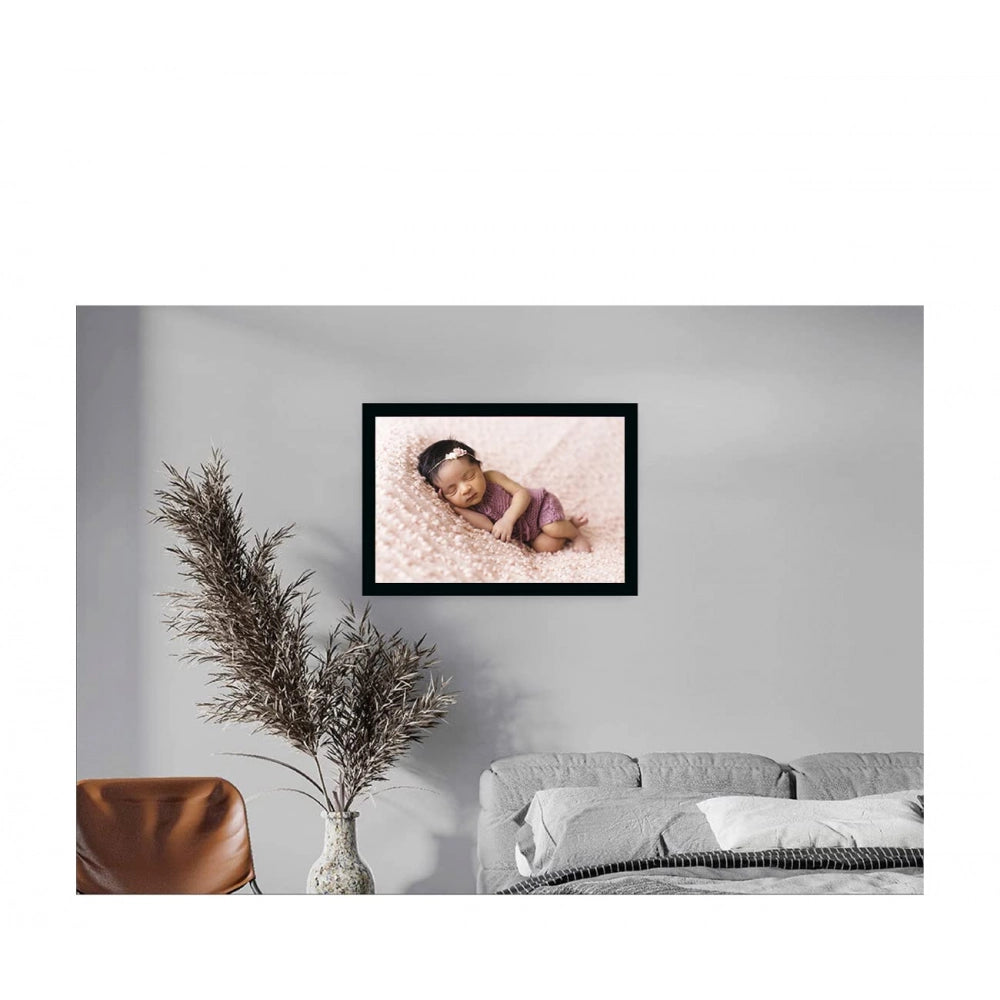 A multicolored, synthetic photo frame with a photo of a baby
