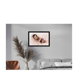 A multicolored, synthetic photo frame with a photo of a baby