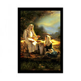 Multicolor painting of Jesus and Mary within a synthetic photo frame