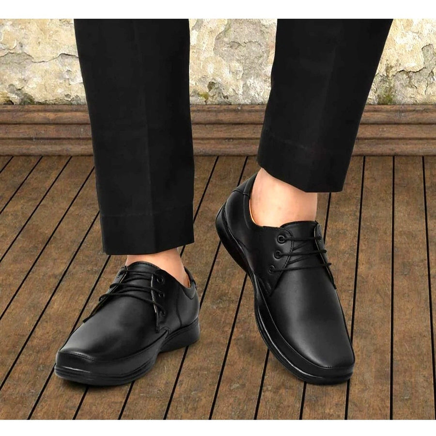 Black synthetic leather formal shoes for men, solid pattern on display stand