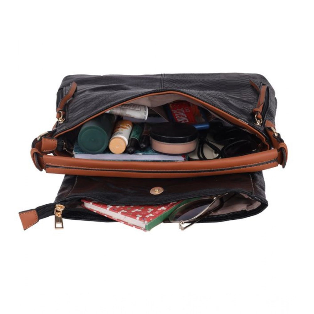 Black faux leather textured sling bag with dual handle, featuring a zipper closure for women's fashion accessories