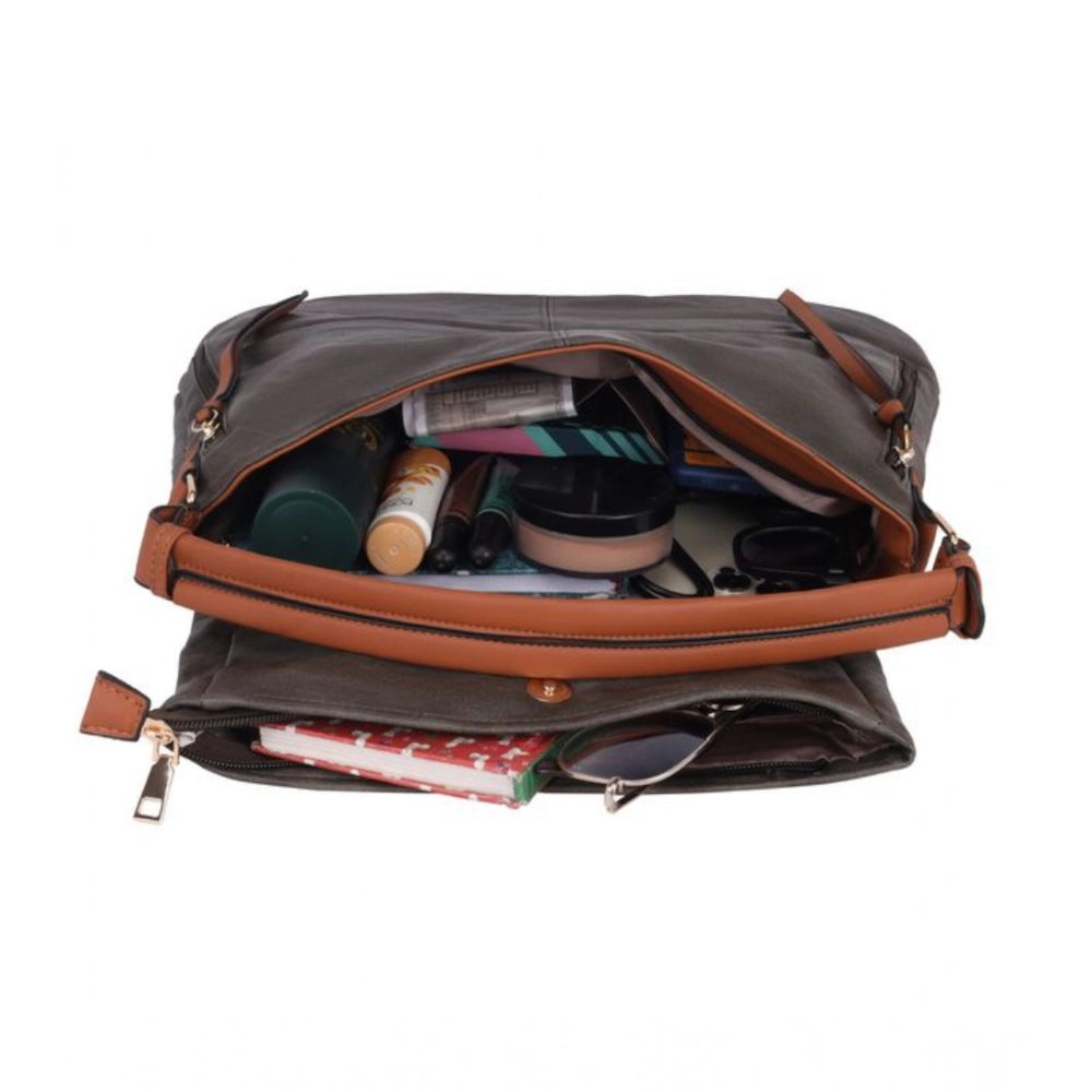 Green faux leather solid sling bag with dual handle, synthetic lining and zipper closure