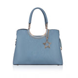 Long blue faux leather handbag with adjustable belt