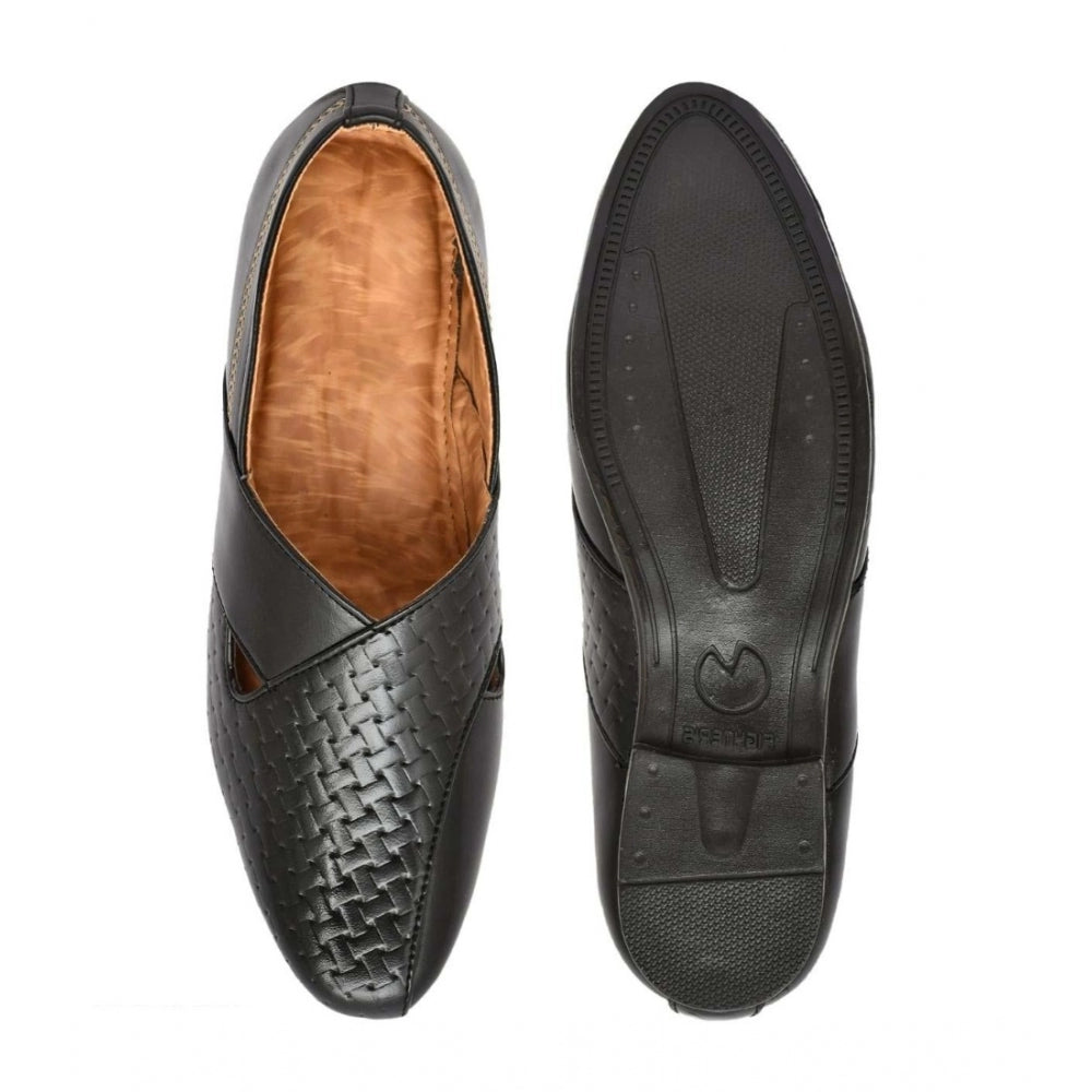 Black faux leather men's formal slip-on shoes on display