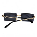 Black metal unisex sunglasses with UV400 protection, classic rectangular frame style on display