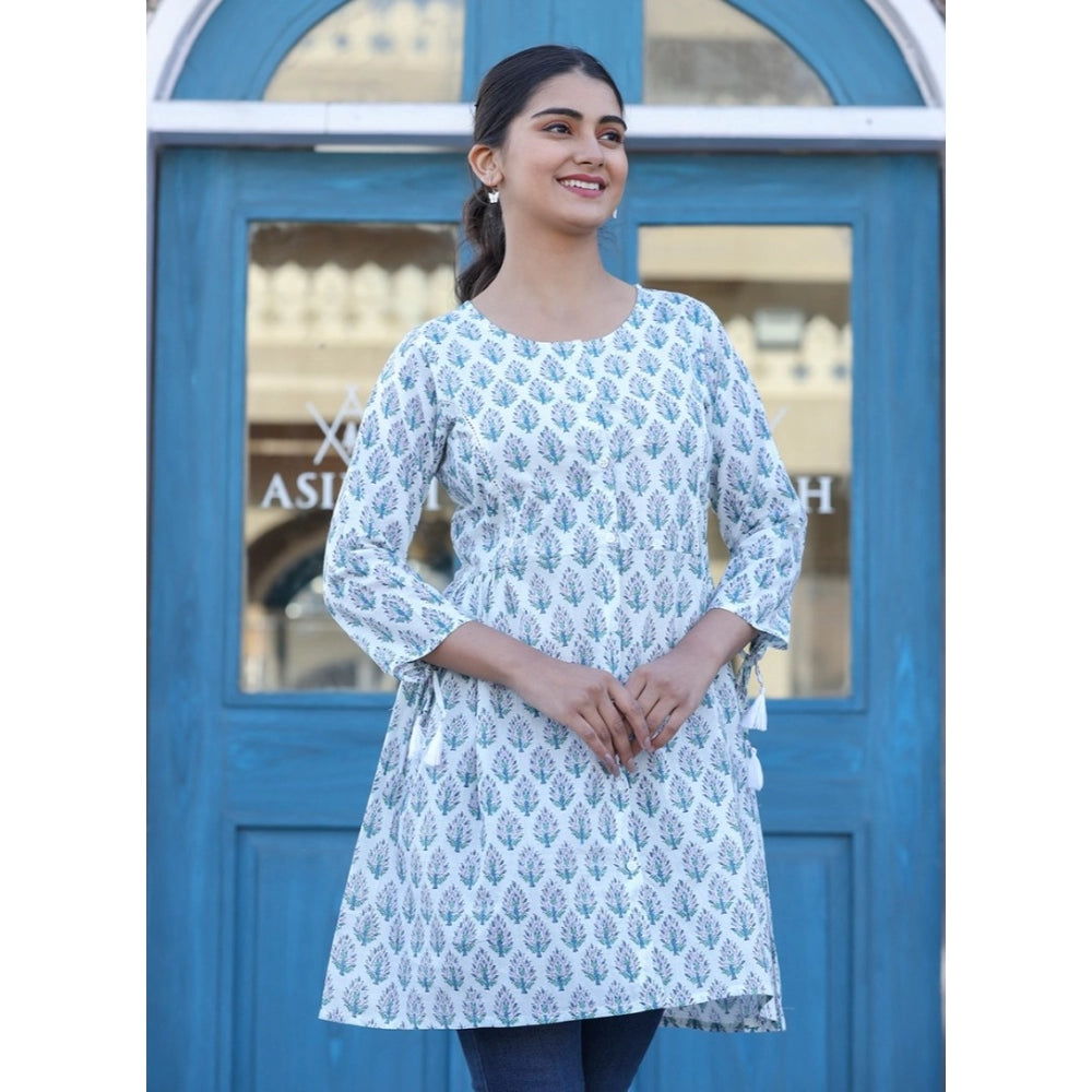 White cotton printed 3/4 sleeve round neck tunic for women, vibrant pattern detail