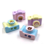 A pack of three camera models, designed as a sharpener, made from plastic and suitable for stationery or children aged 3 years and up
