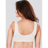 White 4D stretch sports bra by Dermawear, solid design for active women's workouts