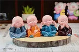 Multicolor Mannat Handcrafted Baby Monk Buddha Set of 4, 12cm polyresin decorative statues