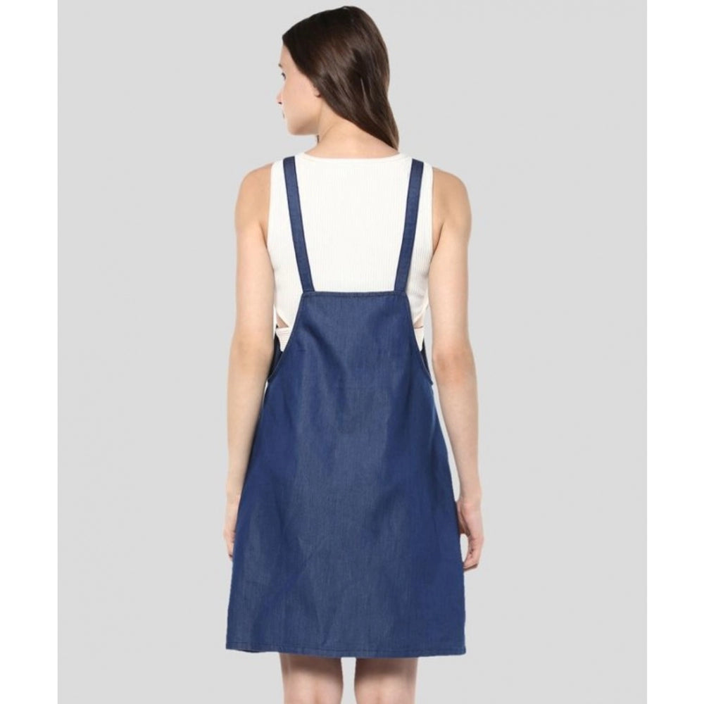 Blue denim dress with solid pattern, above-knee length, and shoulder straps
