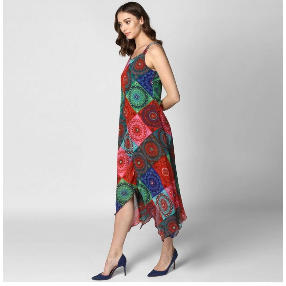 A woman wearing a multi-colored asymmetrical shoulder strap dress with knee-length