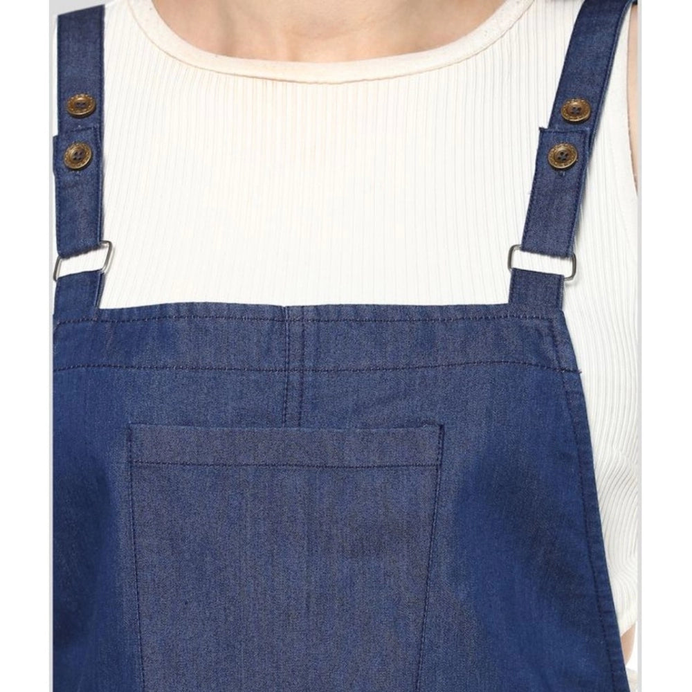 Women's blue denim dress with shoulder straps above knee length